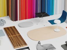 Modern chairs and tables in a colorful design showroom with multicolored curtains and rugs