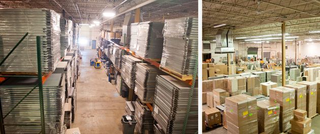 Warehouse aisles stacked with boxes and pallets under bright industrial lights