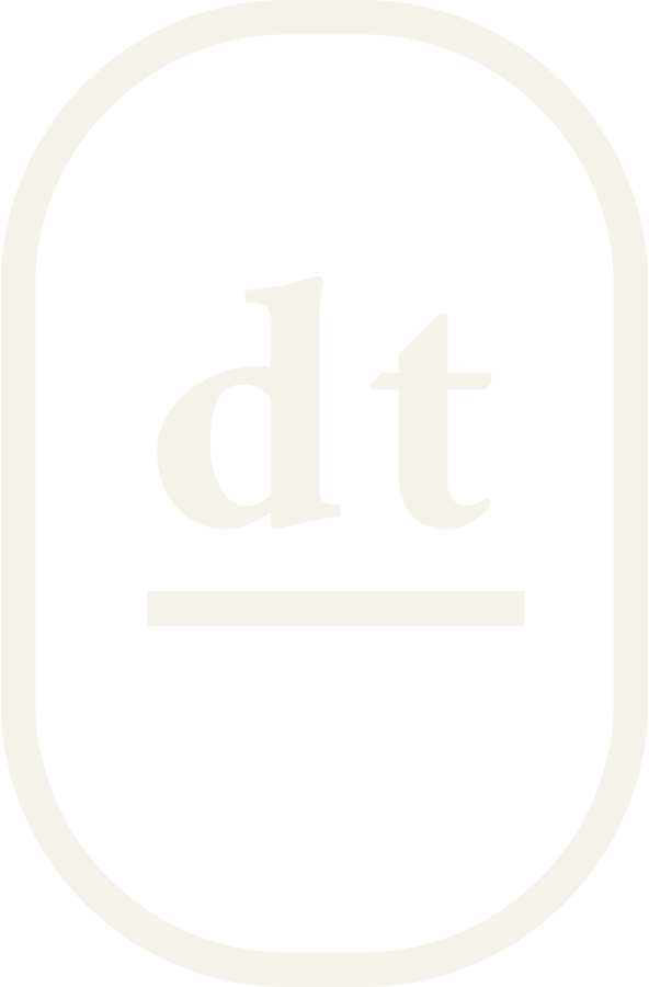 Dan and Tyler Photography badge logo. An oval with dt centered above an underline