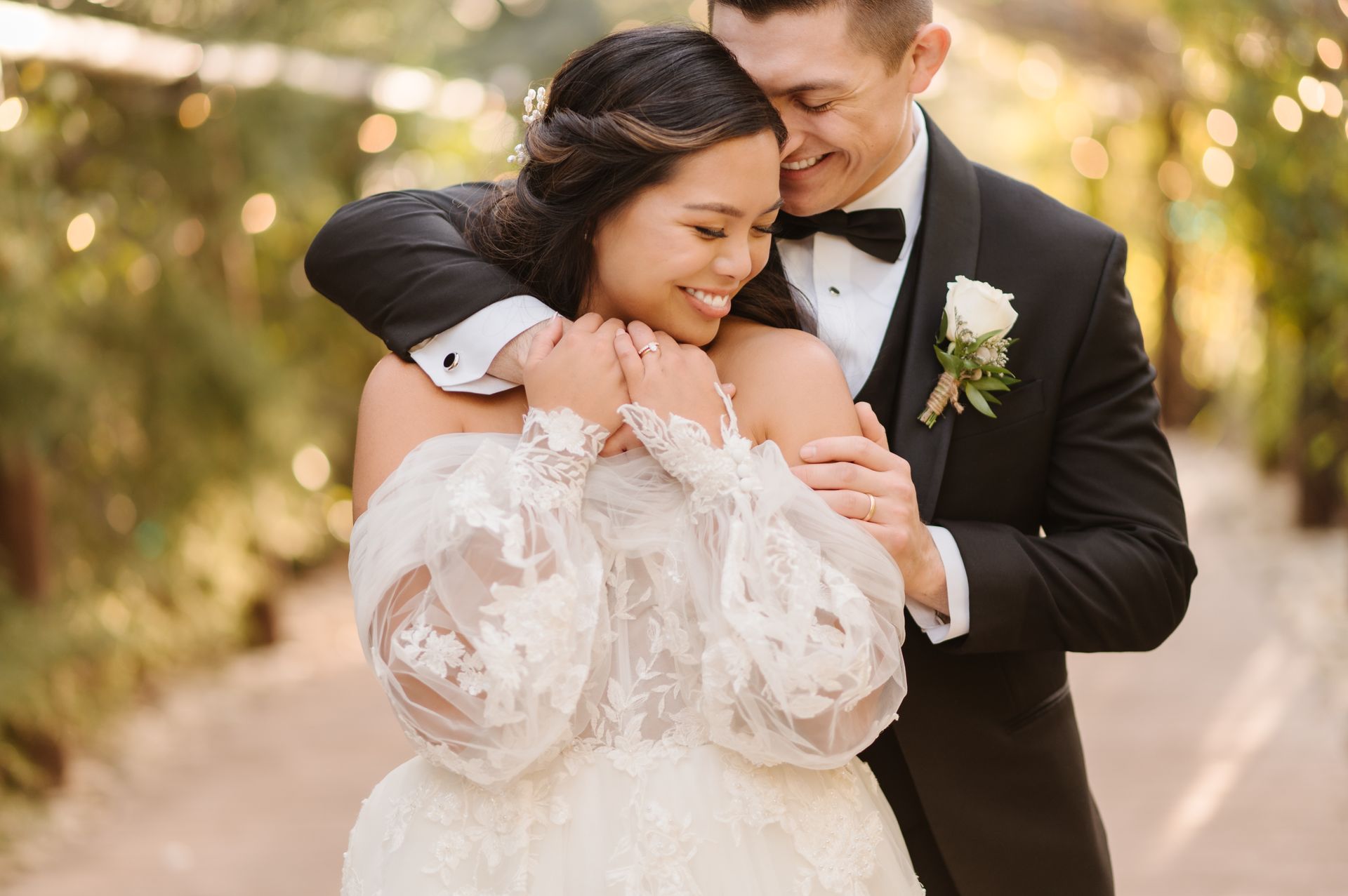 A bride and groom are posing for a picture on their wedding day at Serendipity Gardens.