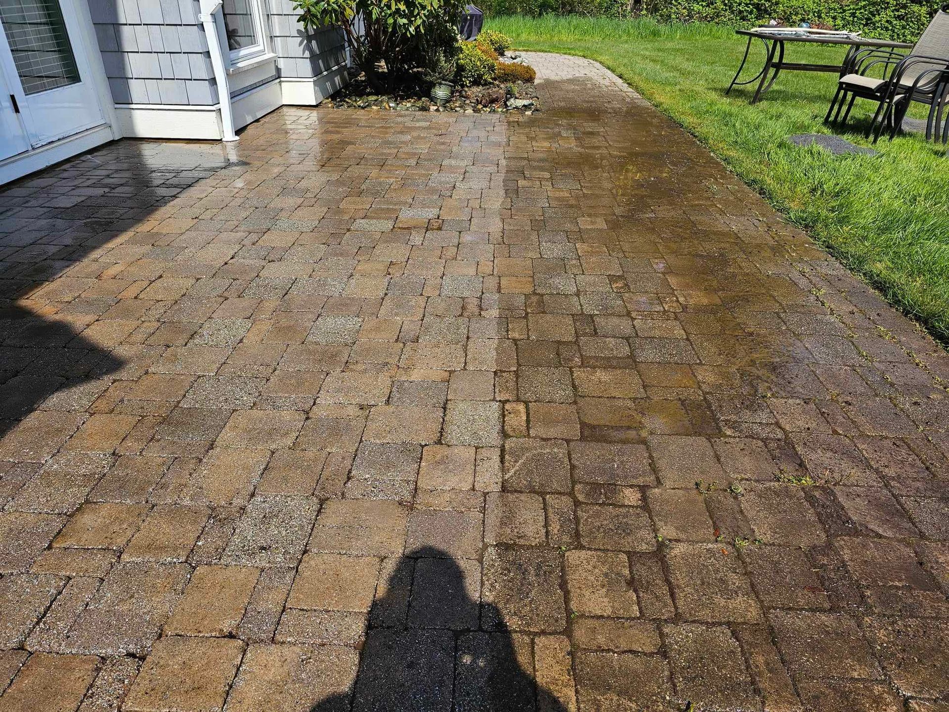 outdoor tiles half way clean, they were being pressure washed while the photo was taken