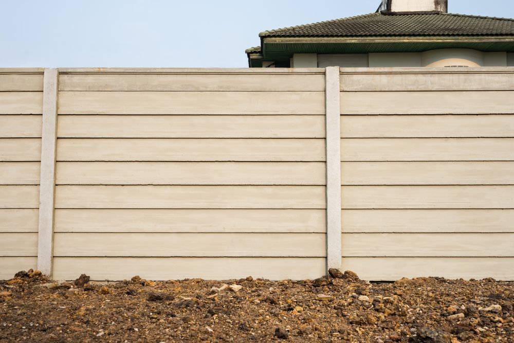 Concrete Panel Fence in Front of a House — B&T Earthworks & Civil in Yorkeys Knob, QLD