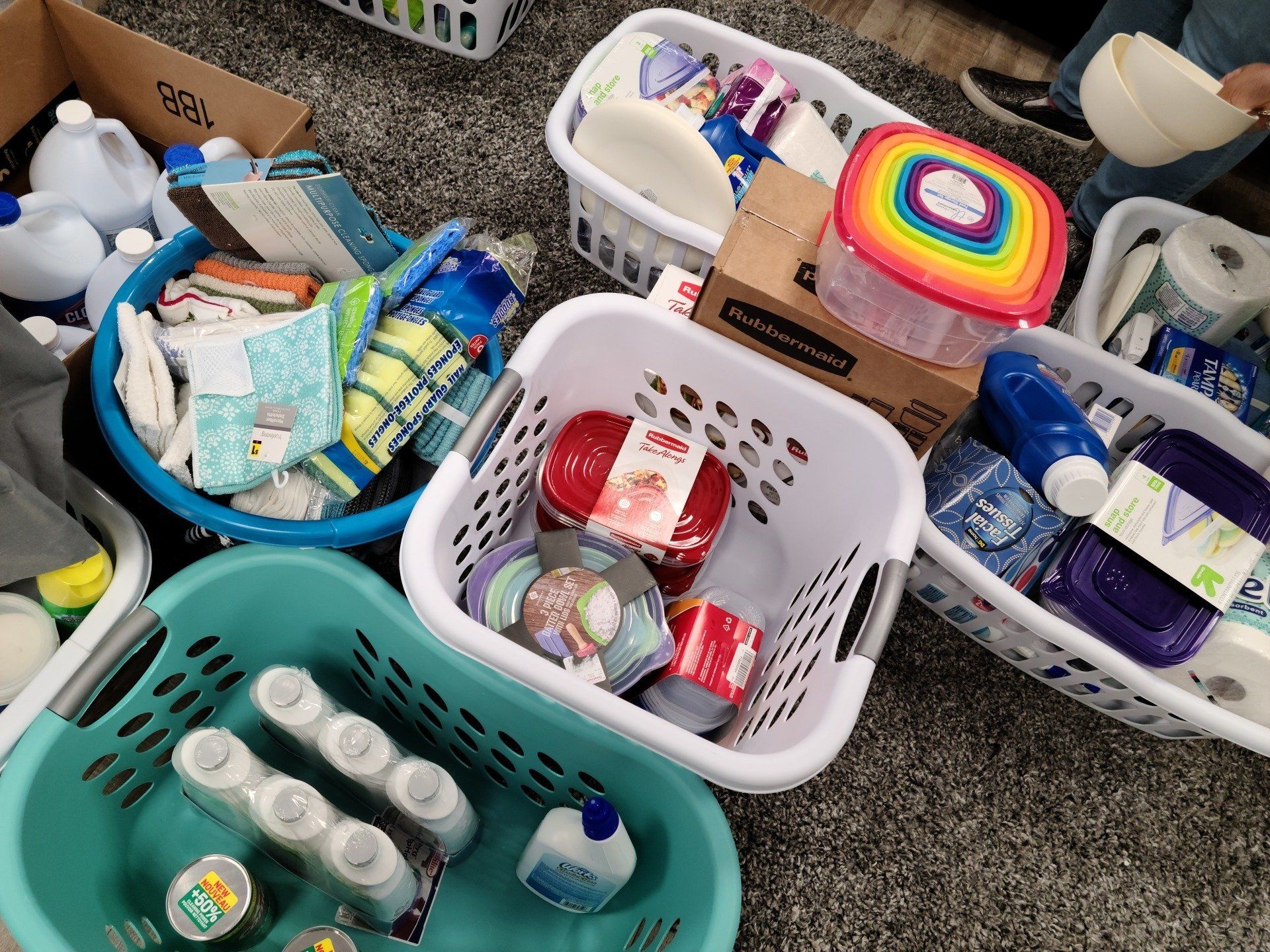 Various baskets filled with cleaning supplies and household items.
