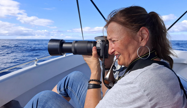 Francoise Vaal photographing whales in the Caribbean sea.