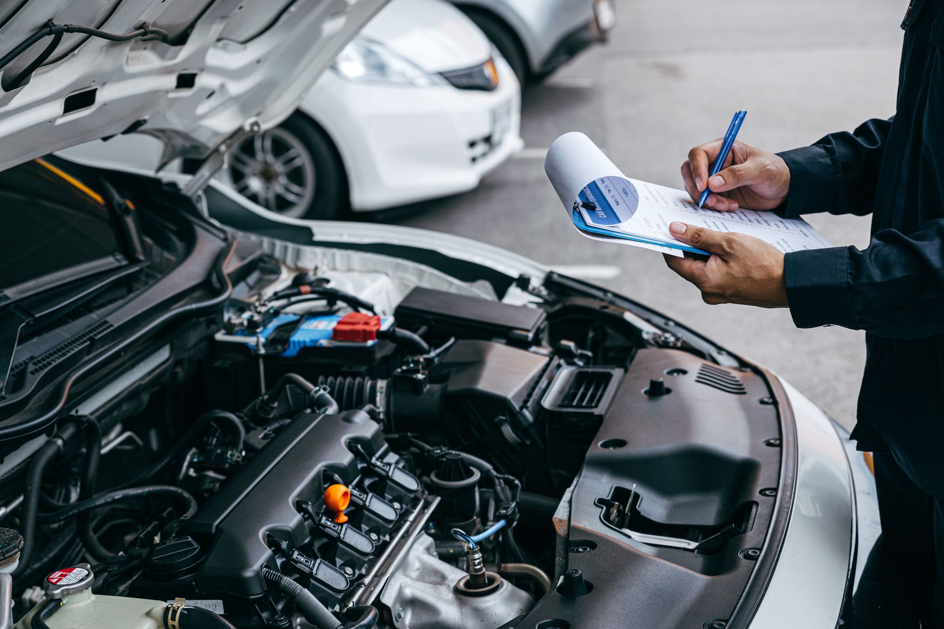 Technician completing an inspection checklist Technician completing an inspection checklist