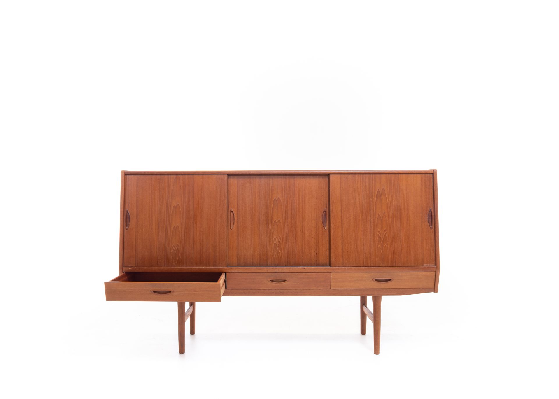 Mid-century modern teak sideboard with sliding doors and a drawer open, against a white backdrop.