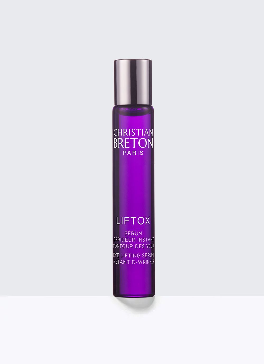 Una botella de color púrpura de Christian Breton Liftox sobre un fondo blanco.