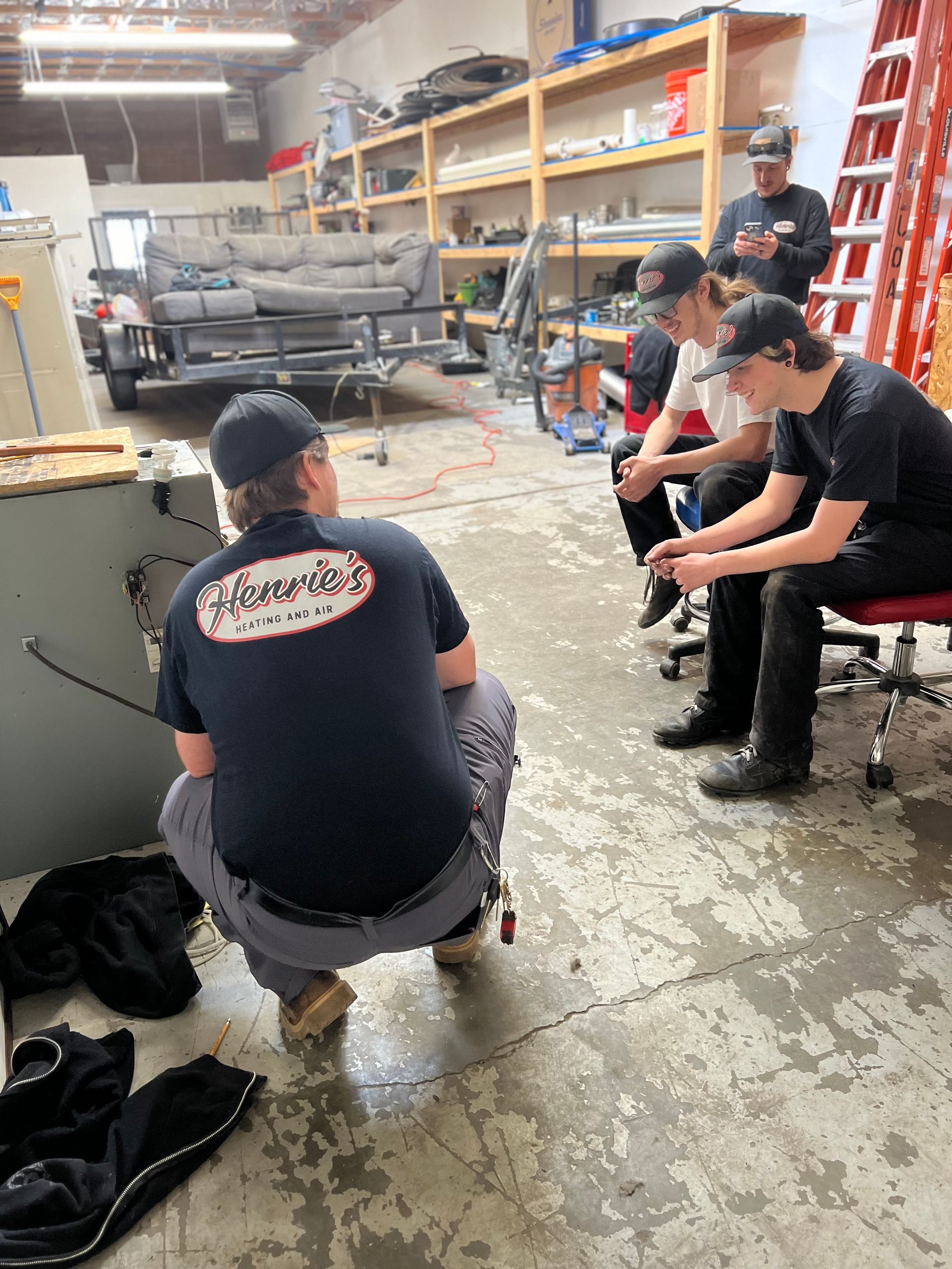 henries heating and air crew doing training in the shop in salt lake city