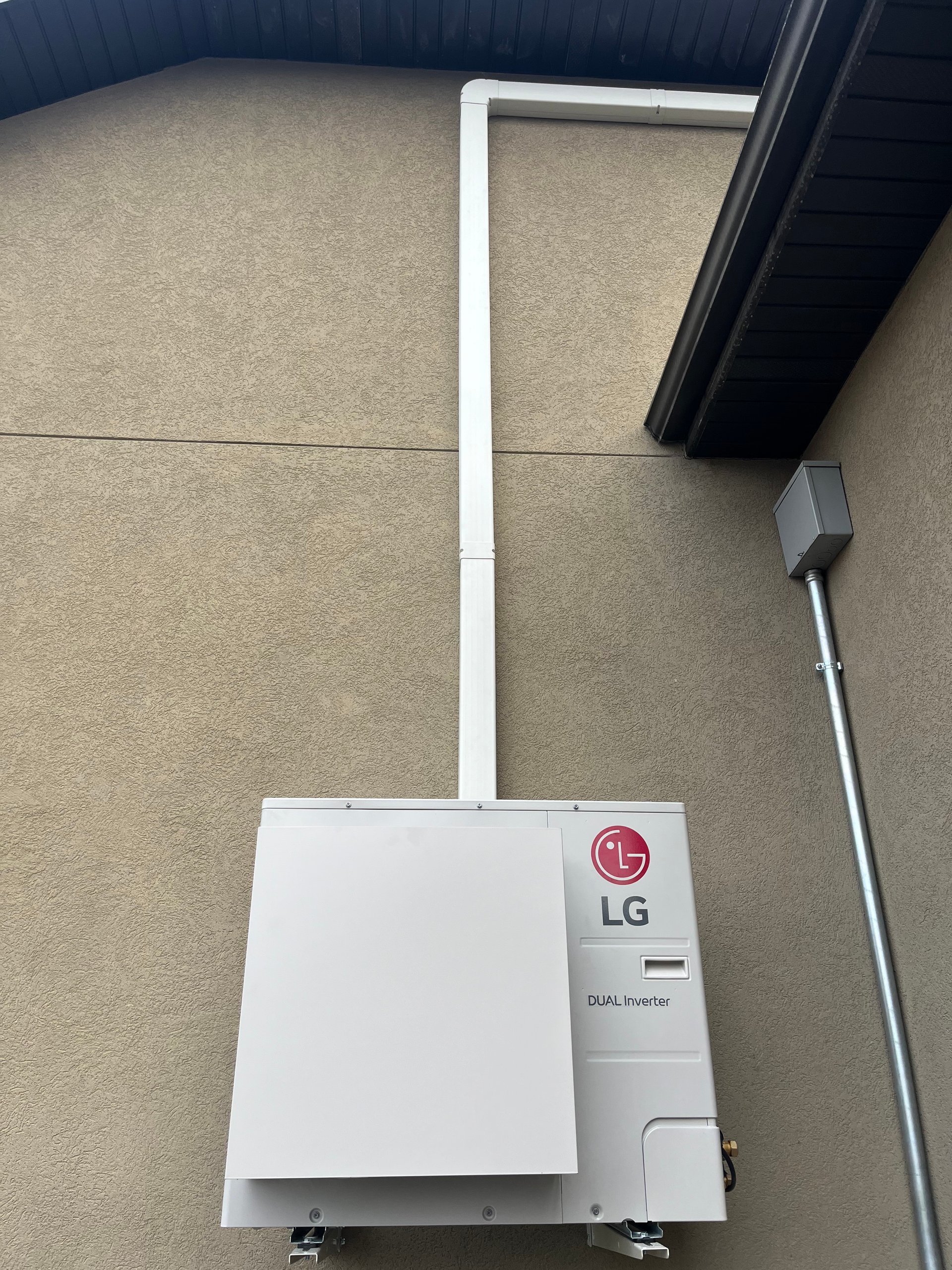 lineset cover installed on the side of a home by henries heating and air in salt lake city