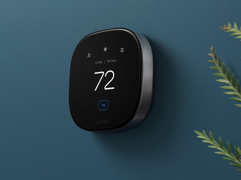 smart thermostat installed on a wall of a home