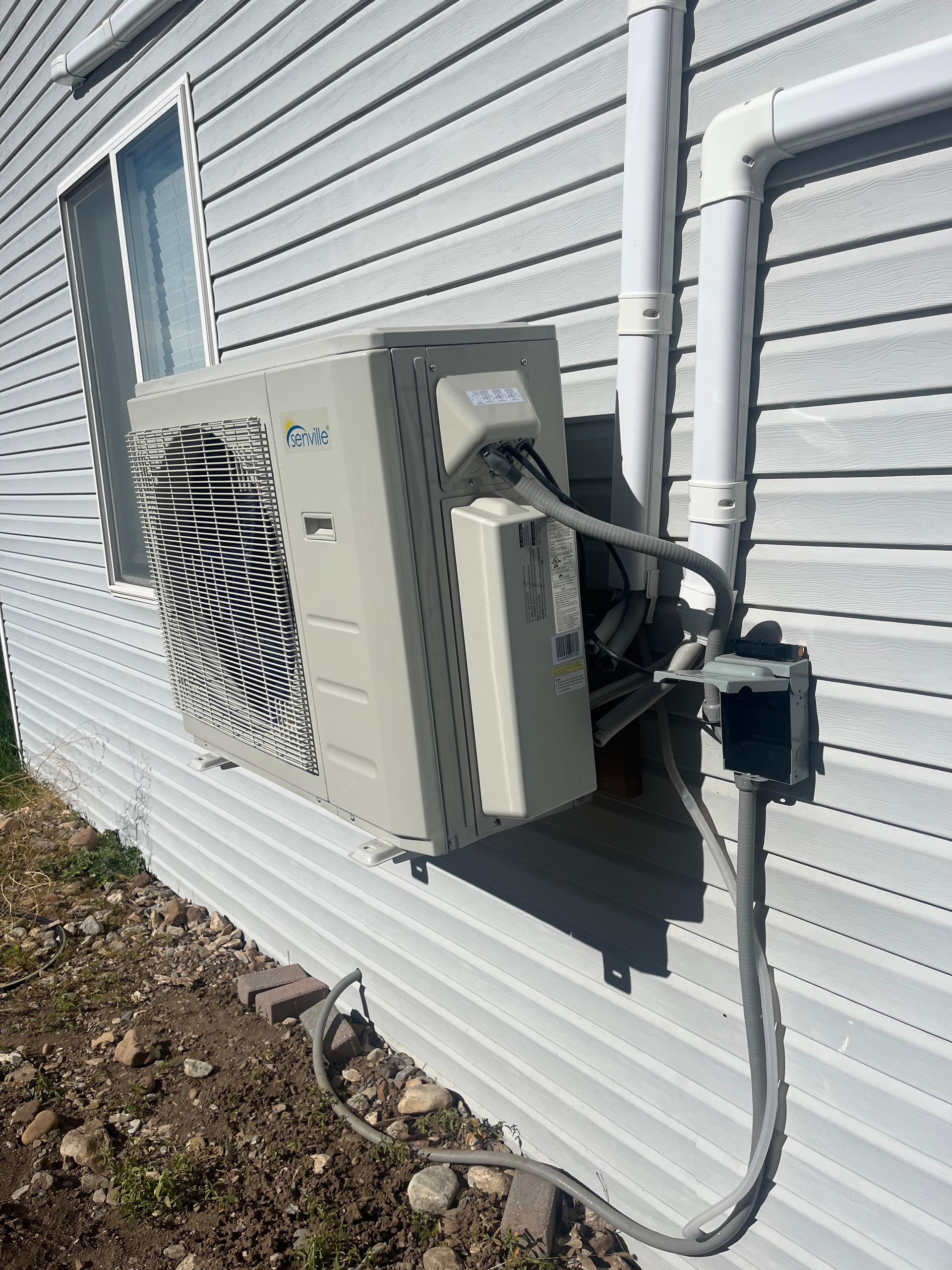 mini split/ heat pump outdoor unit installed by henries heating and air in salt lake city