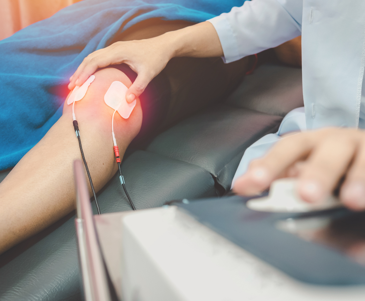 A person is getting a laser treatment on their knee.