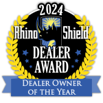 2024 Rhino Shield Dealer Award badge with black, gold, and blue laurel, “Dealer of the Year” ribbon