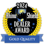 2024 Rhino Shield Dealer Award badge with gold laurel and blue “Gold Quality” ribbon