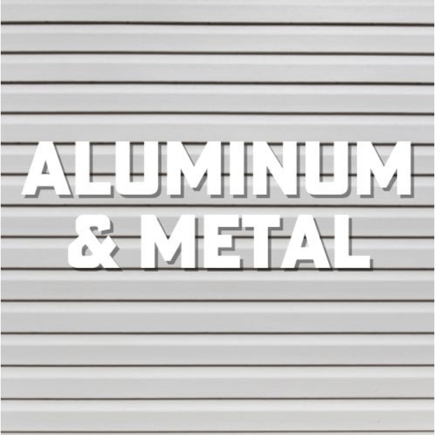 White sign reading “ALUMINUM & METAL” on a gray corrugated background