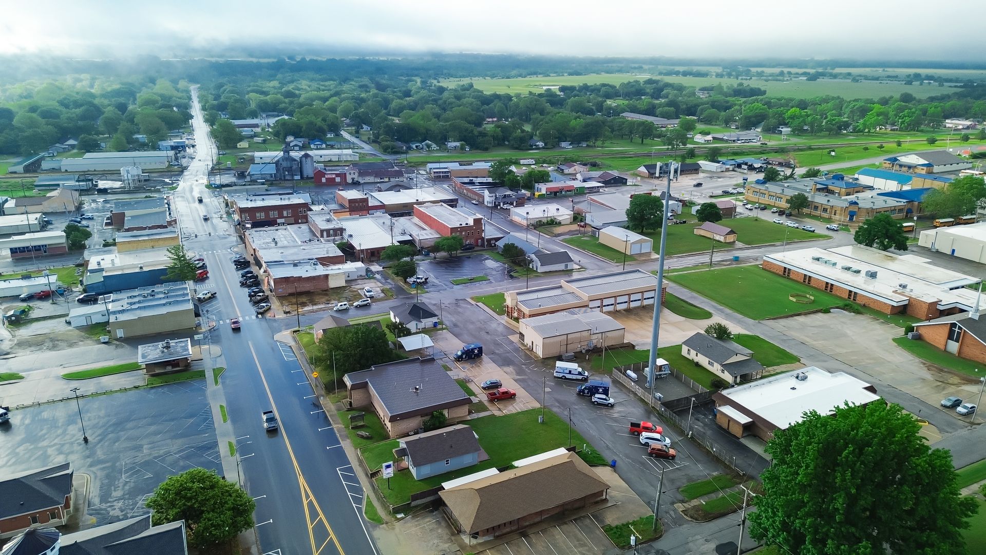 An aerial view of a small town on a cloudy day.