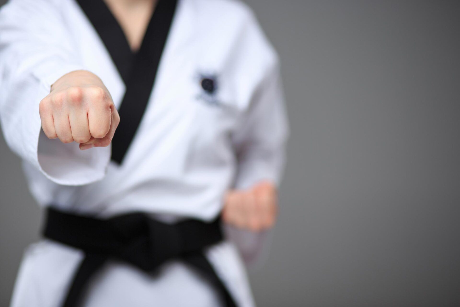 People kneeling in karate class