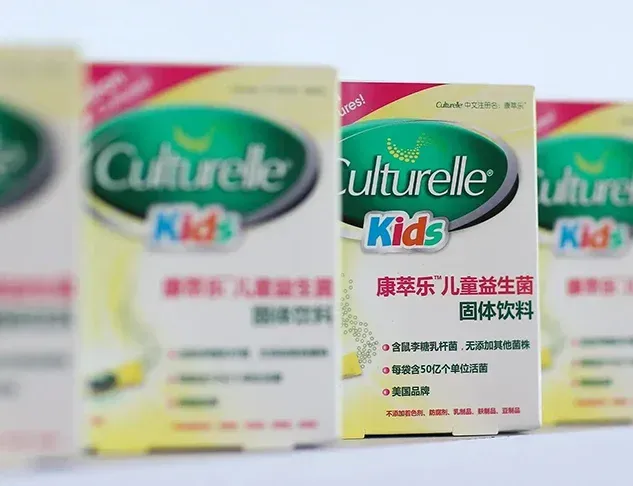 Three boxes of culturelle kids are lined up on a table.