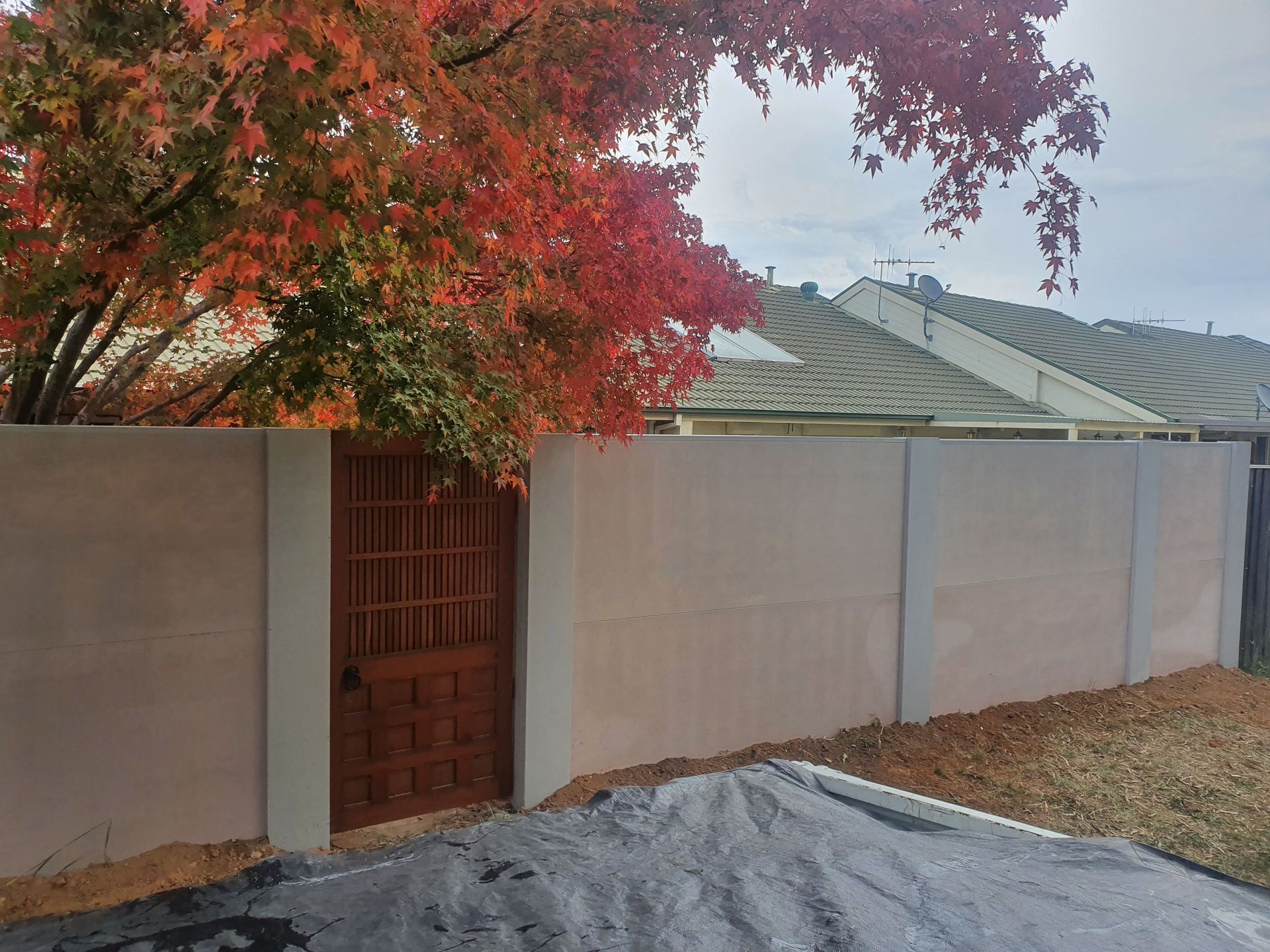 A Staircase Leading up To a Building with A Fence in The Background — GnB Fencing and Excavation in Queanbeyan, NSW