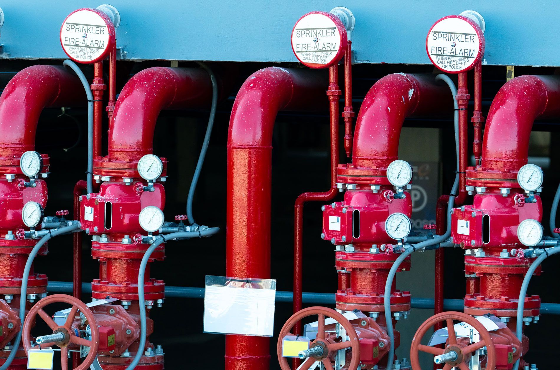 Red fire suppression system pipes and valves.