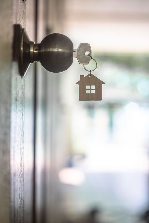 Photo of a key in a door lock