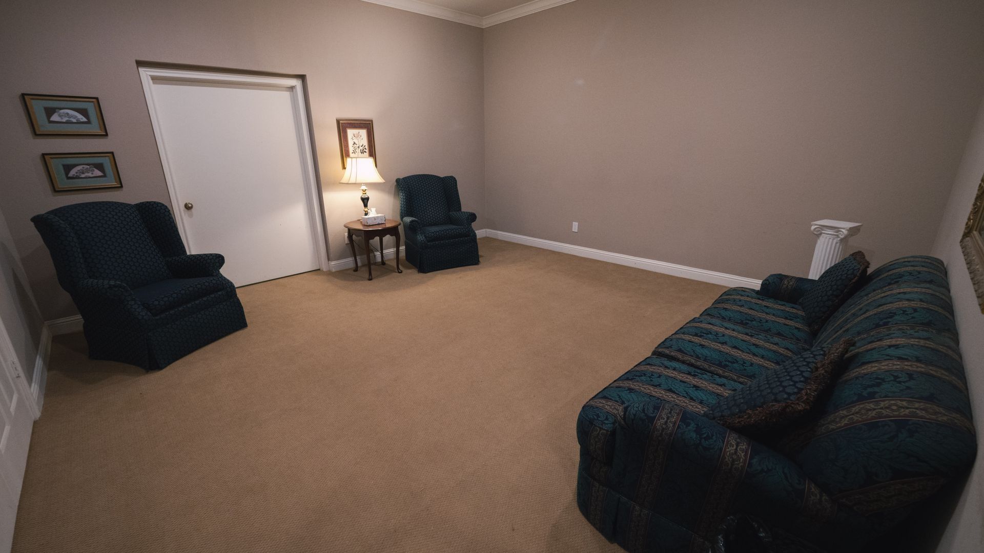 There is a coffin in the middle of the living room.