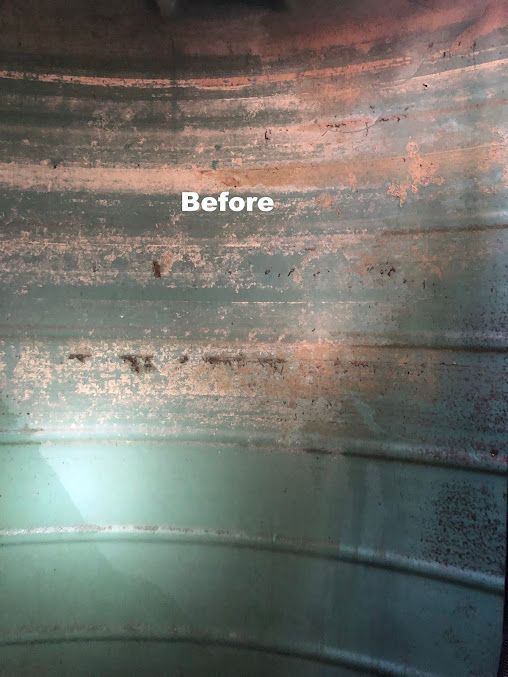 A Close Up Of A Rusty Metal Inside Of A Water Tank — Alligator Water Tank Cleaning In Pomona, QLD