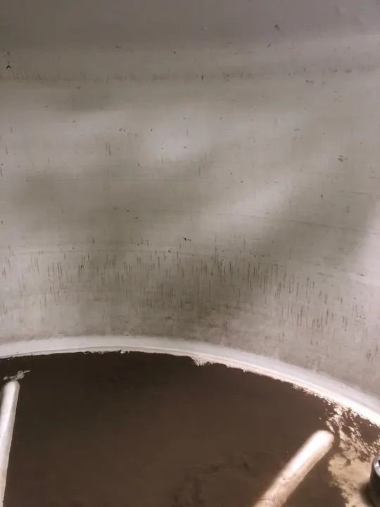 A Close Up Of A Dirty Wheel With A White Rim — Alligator Water Tank Cleaning In Pomona, QLD