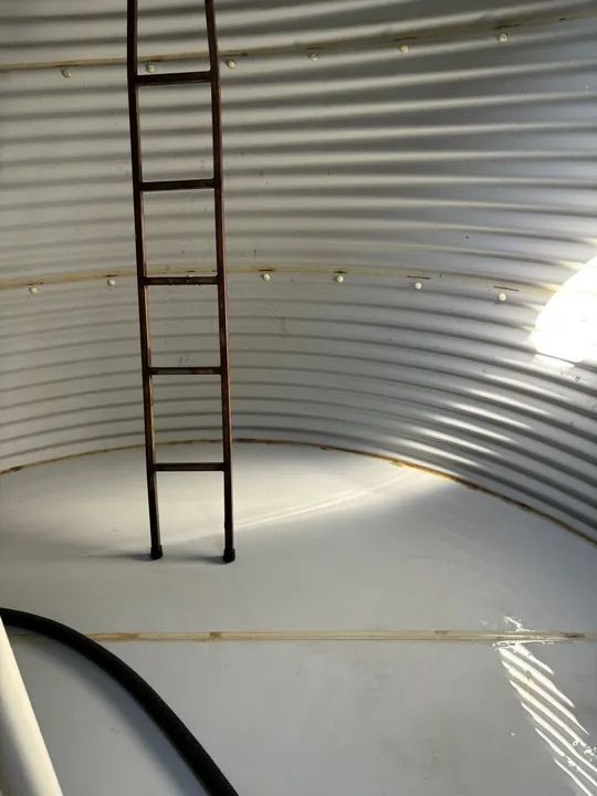 A Ladder Is In The Middle Of An Empty Tank — Alligator Water Tank Cleaning In Pomona, QLD
