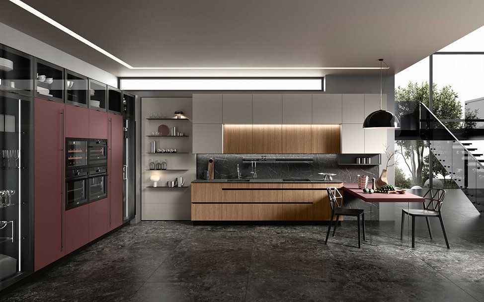 Cucina moderna con mobili rosa e in legno, ripiani grigi e pavimento scuro.