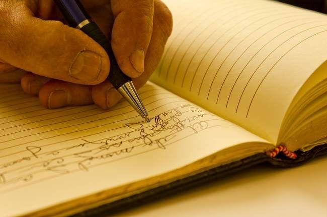 Writing on notebook - Atlanta, GA - Progressive Growth Coaching
