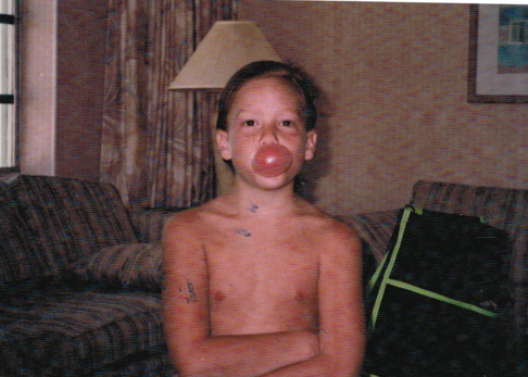 Young Evan Kirstein blowing a gum - Atlanta, GA - Progressive Growth Coaching