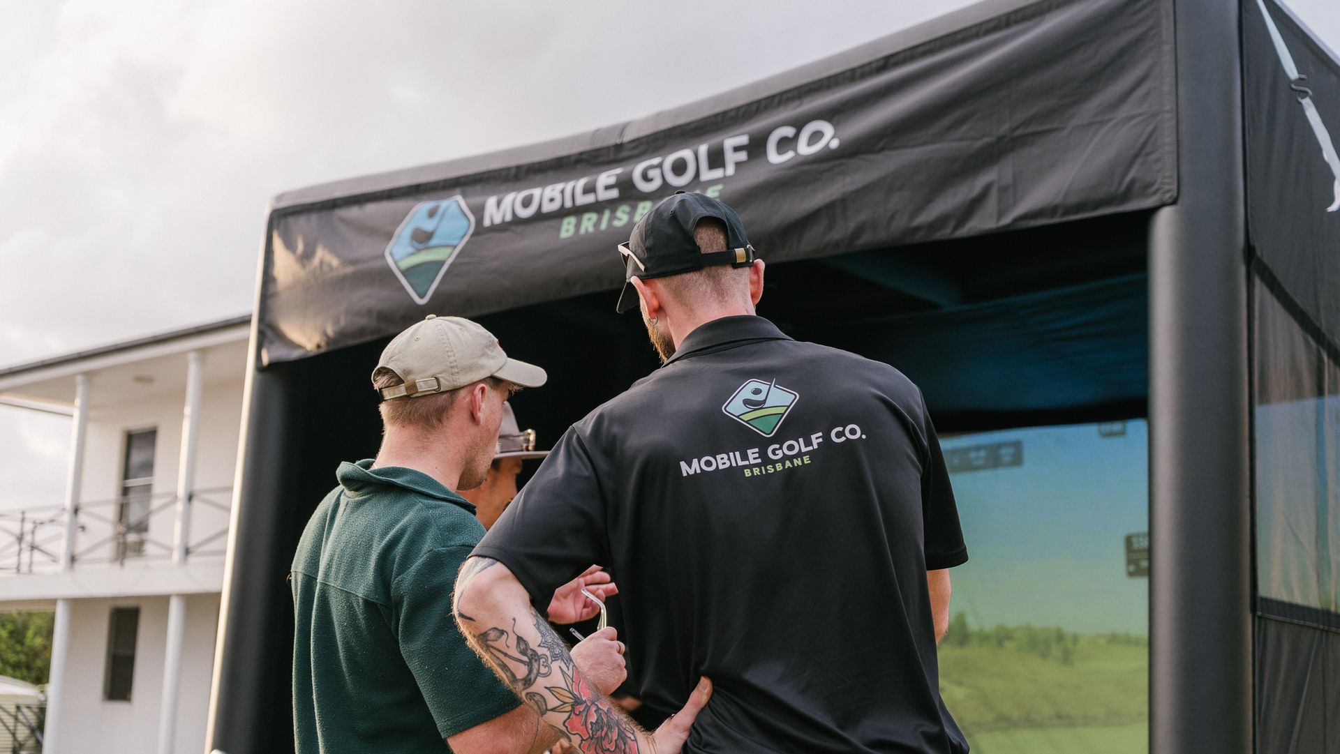 A Mobile Golf Co host explaining launch monitor data to a participant