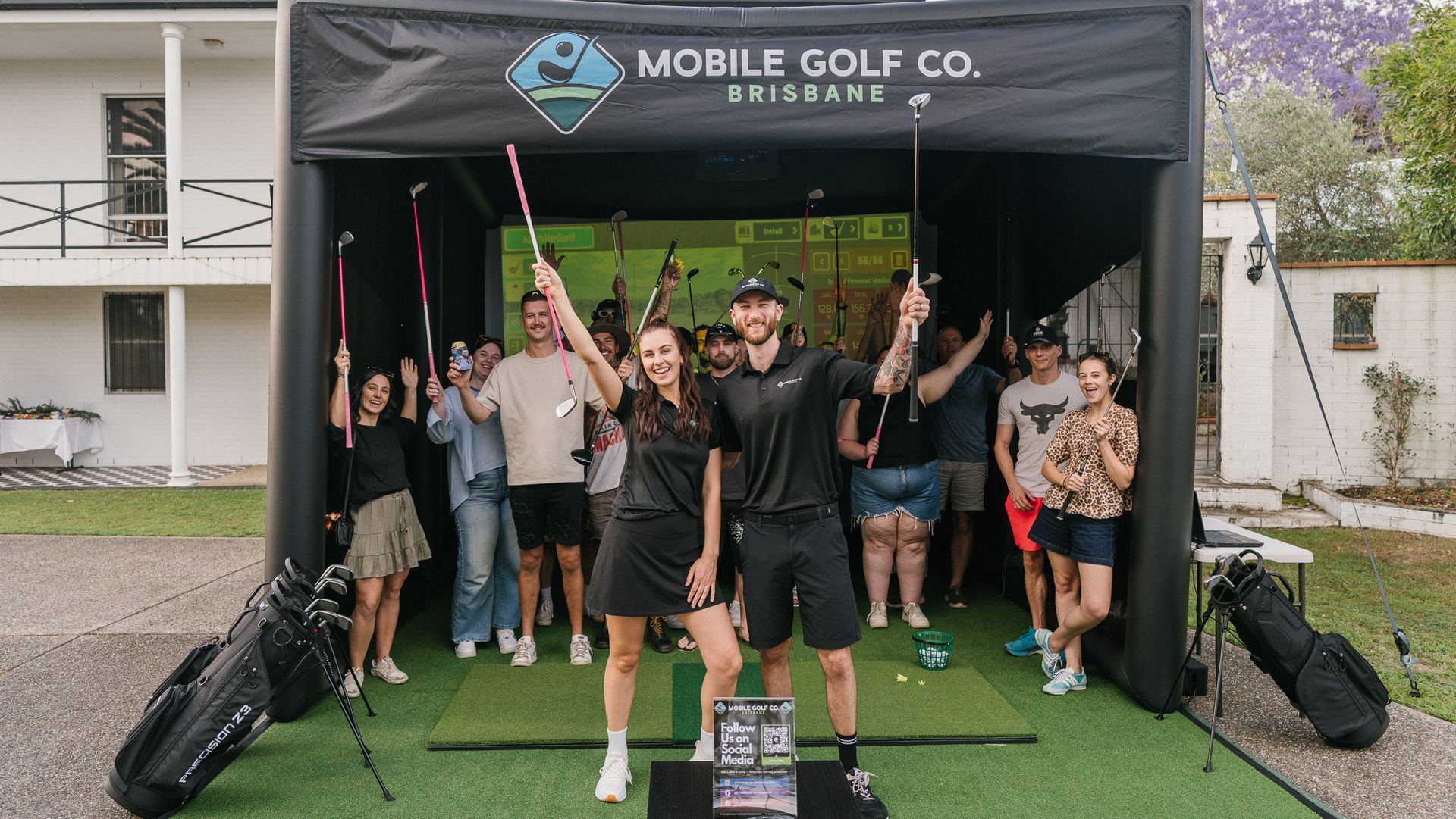 the Mobile Golf Co team cheering and celebrating a successful event.