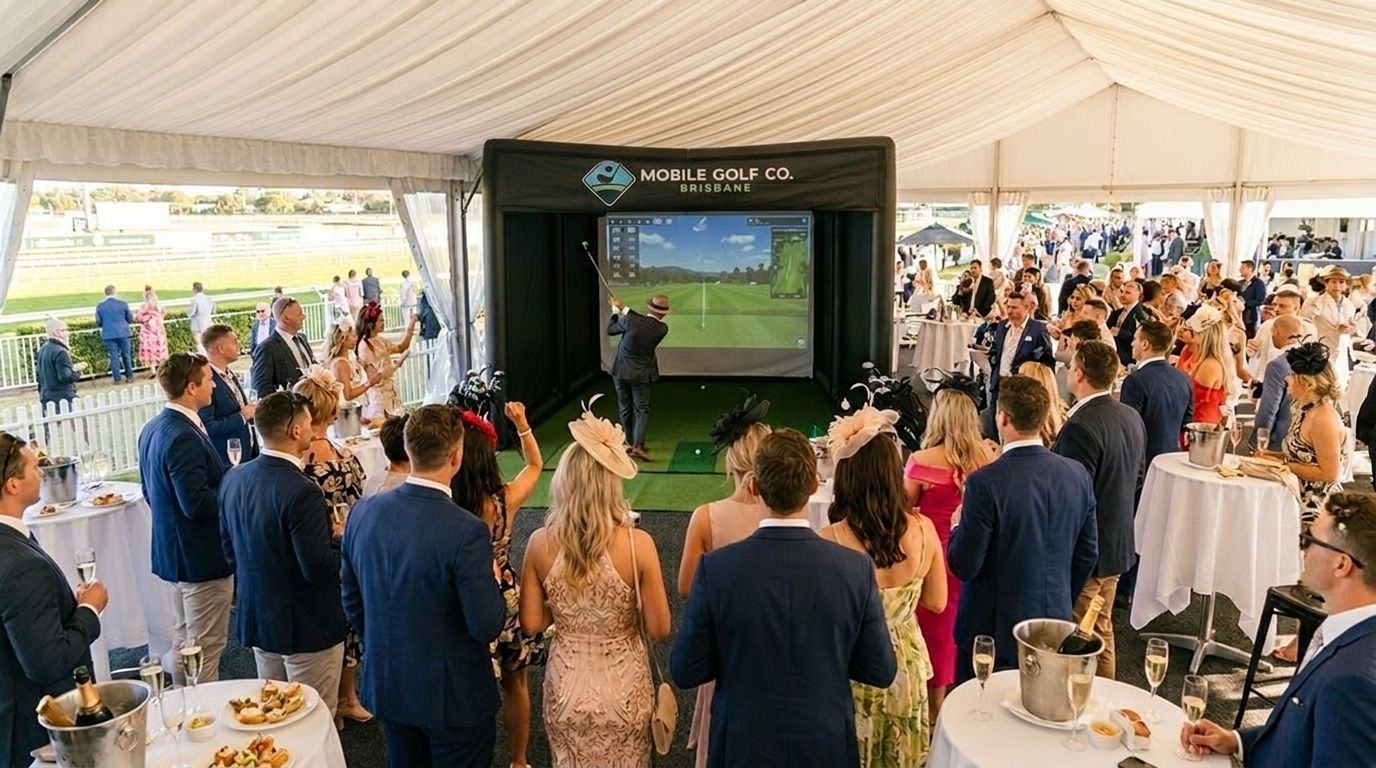 Guests gathered in a white tent watching a golf simulator on a large screen at a racing event