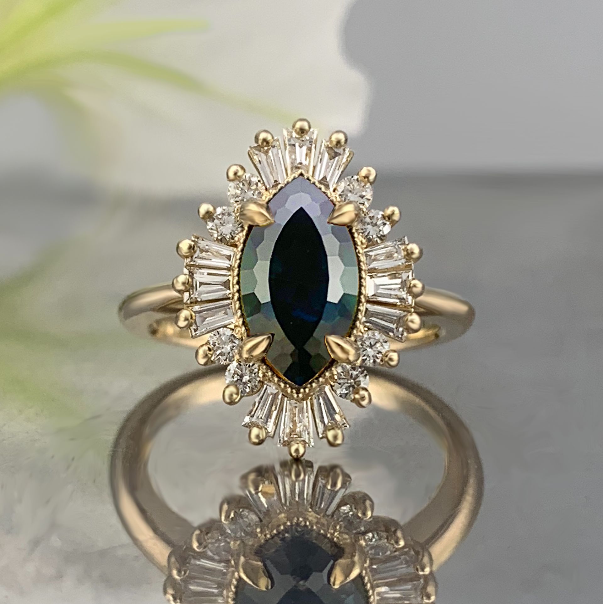 A gold ring with a black stone and diamonds