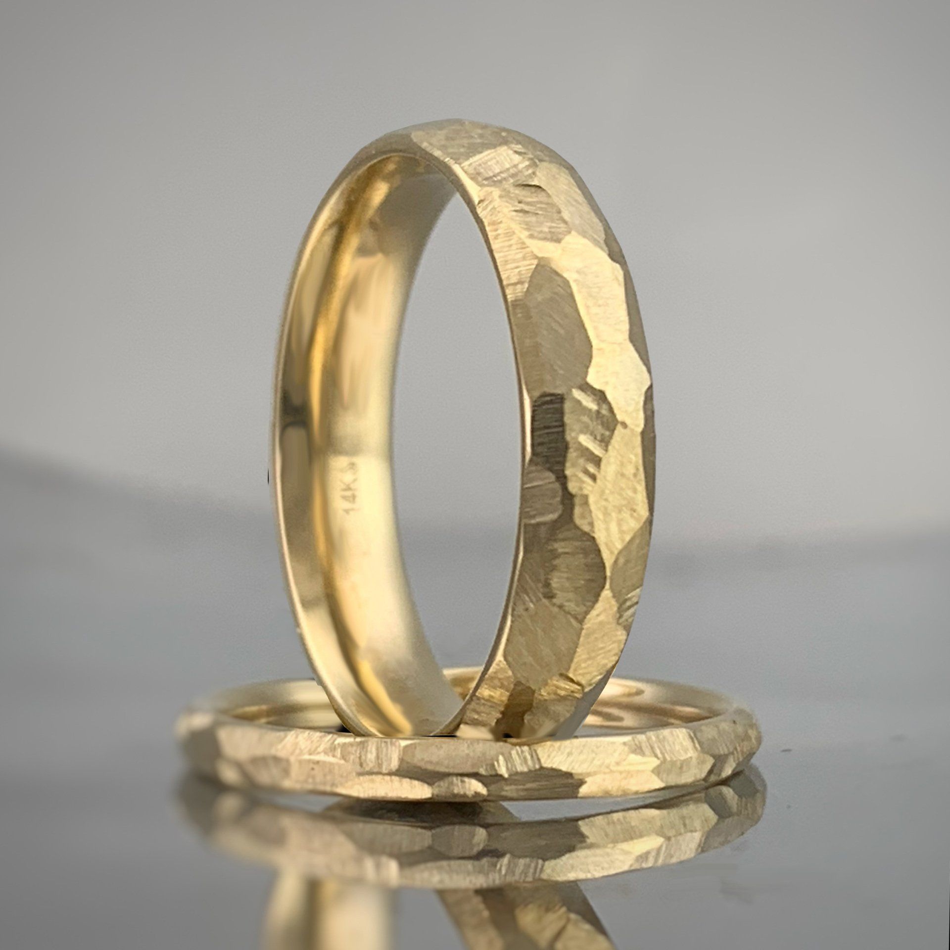 Two gold rings are stacked on top of each other