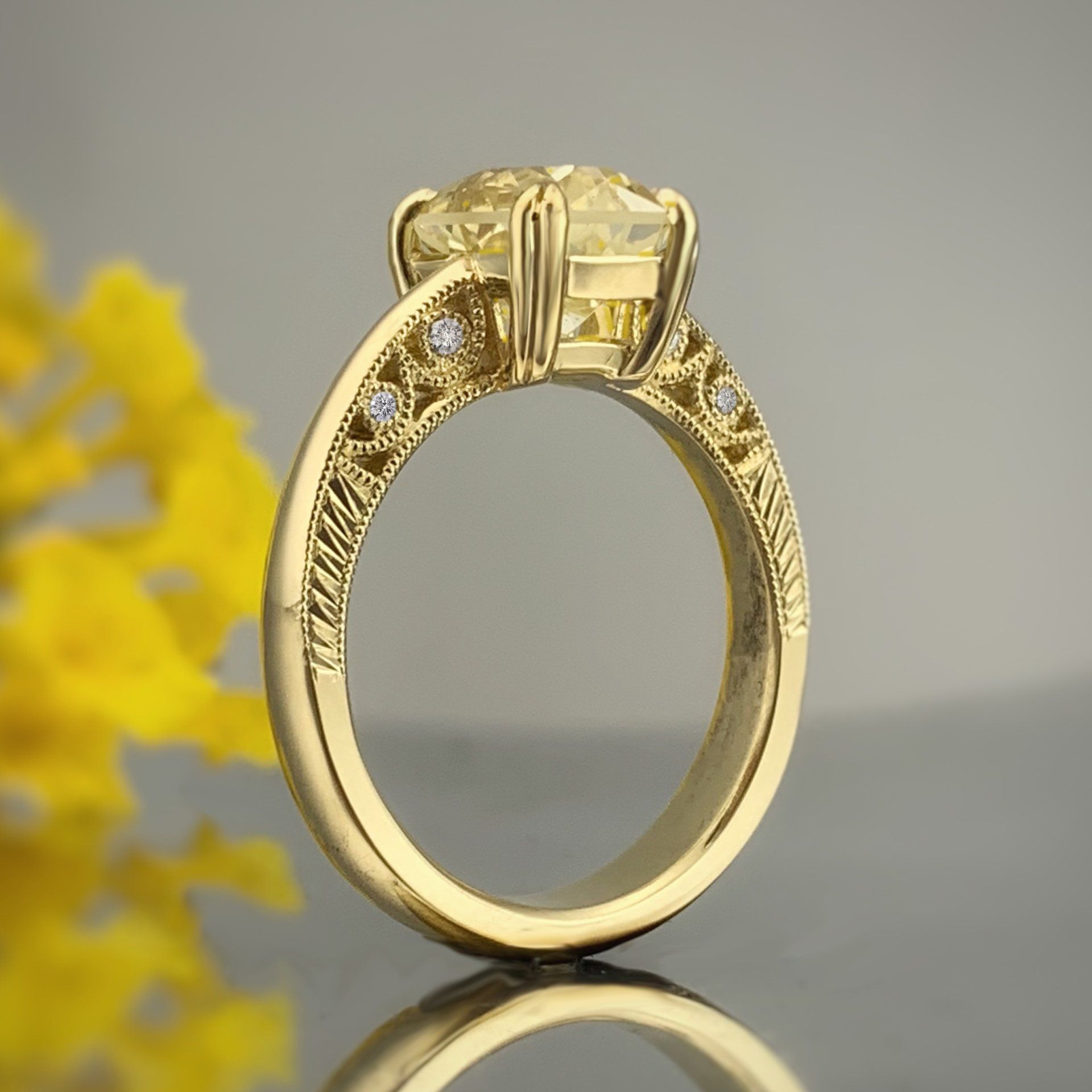 A yellow gold ring with a large diamond in the center