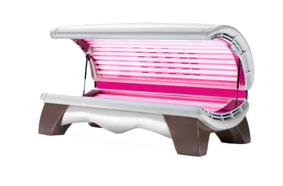 Pink tanning bed with a white shell and brown base on a white background