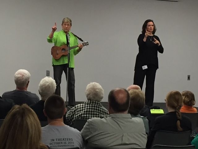 photo with musician-storyteller and ASL Interpreter at KY Storytelling Conference