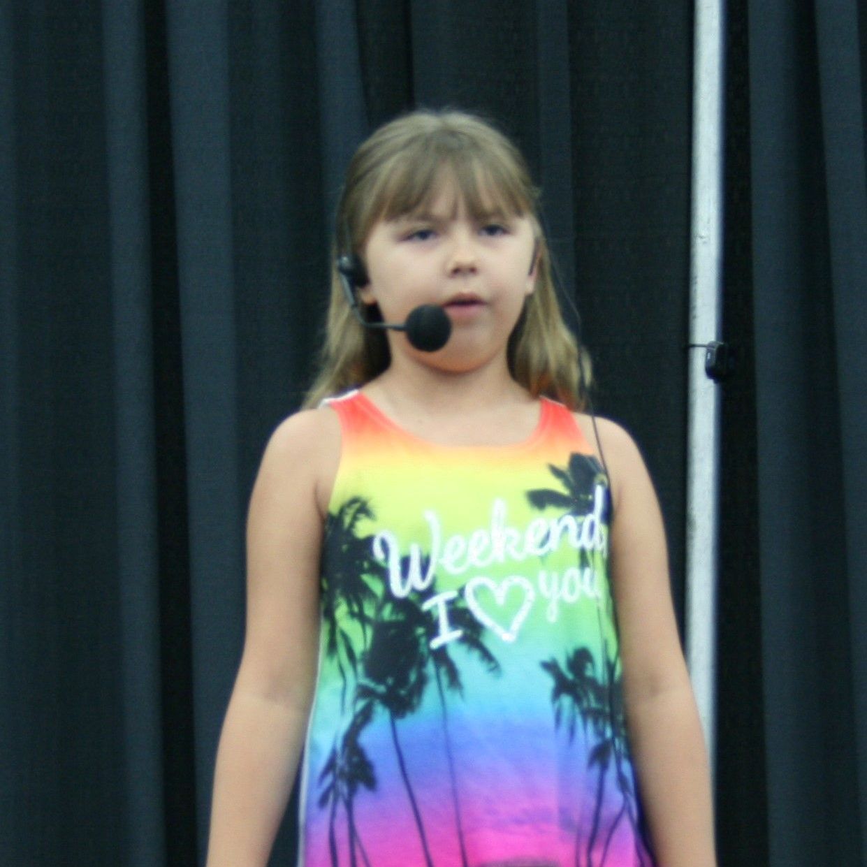 Young girl telling at the State Fair.