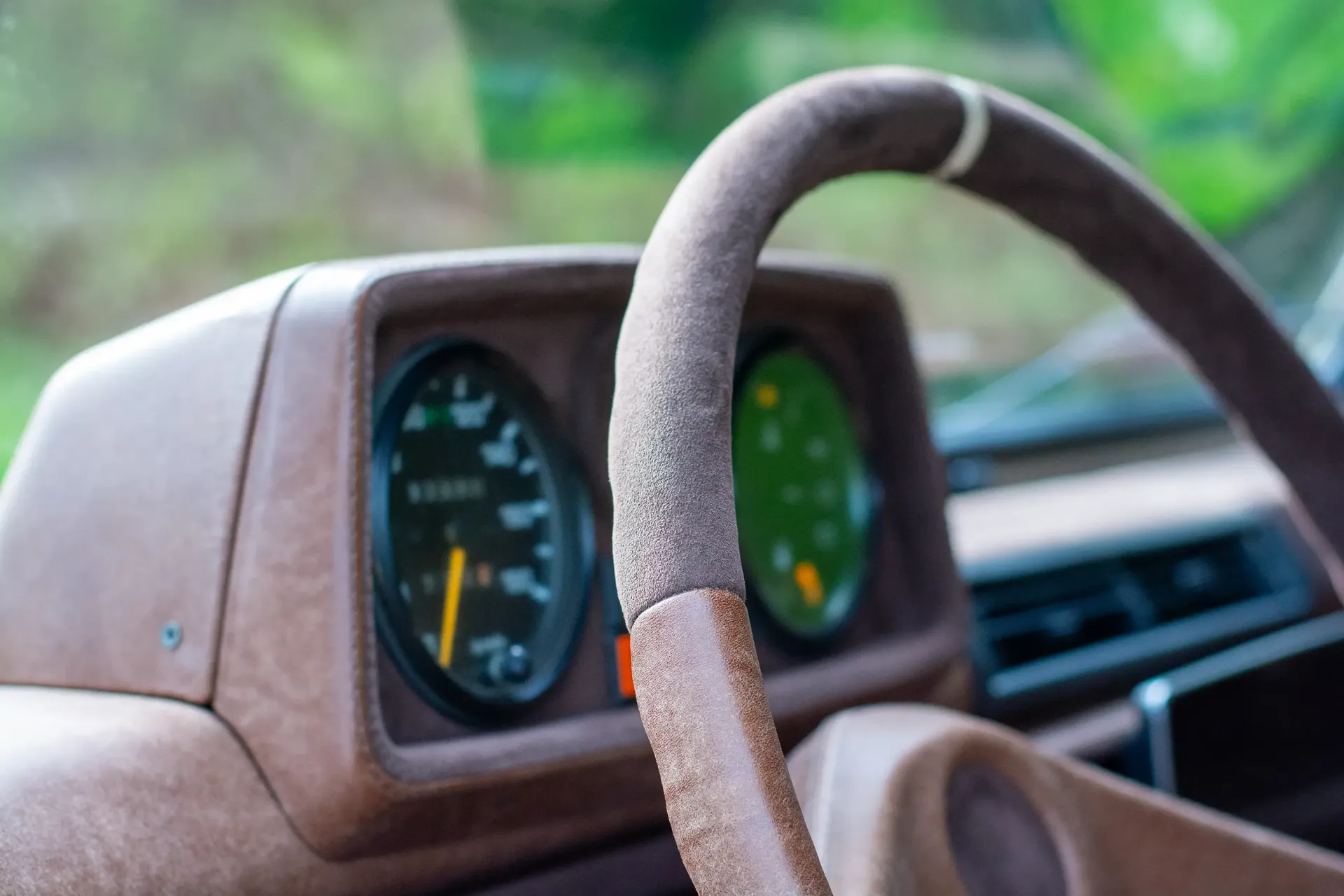 A close up of a car steering wheel and dashboard, G-Wagon interior
