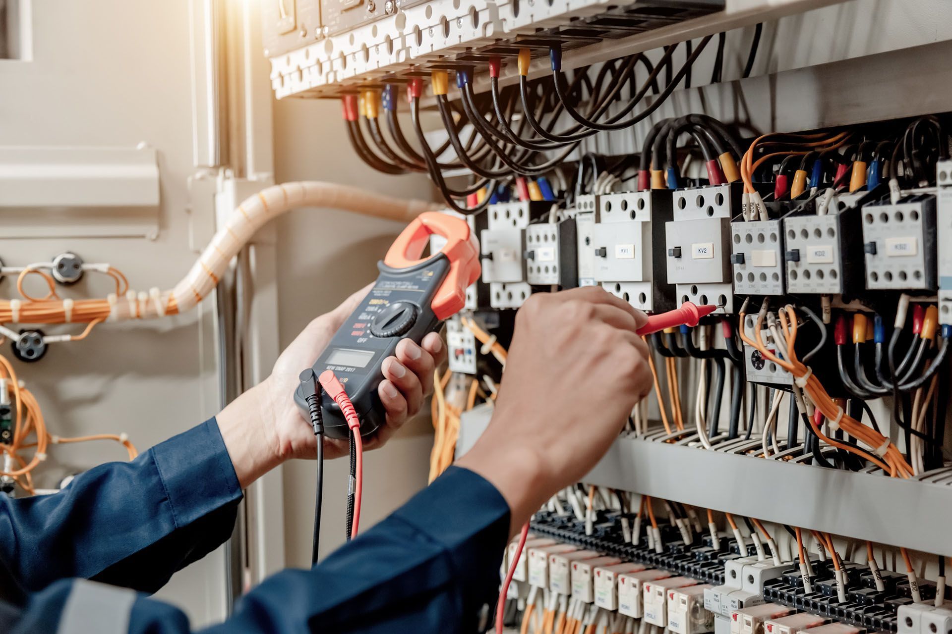 Electrician engineer work tester measuring voltage and current of power
