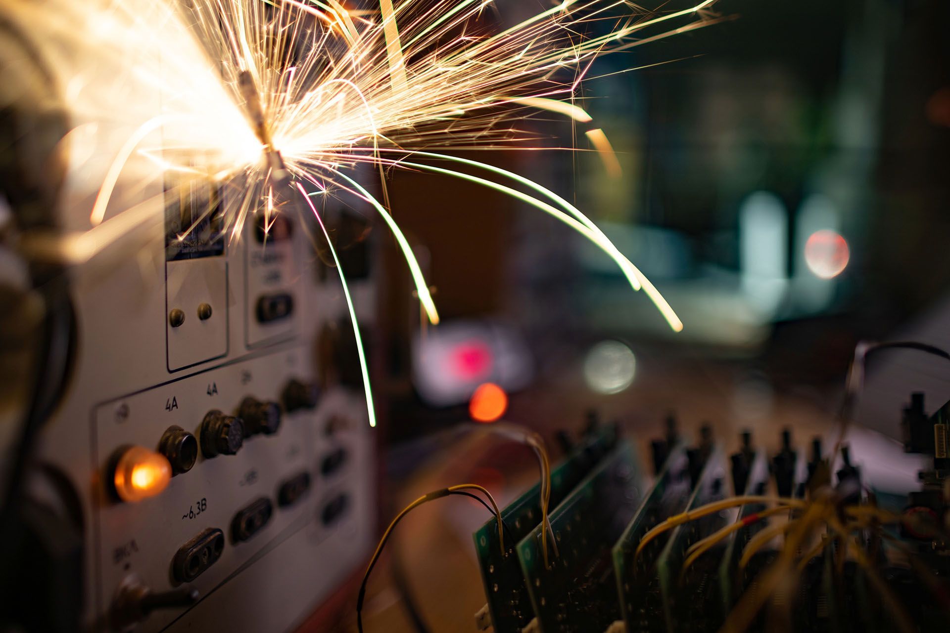 Electronic device with sparks coming out of it.