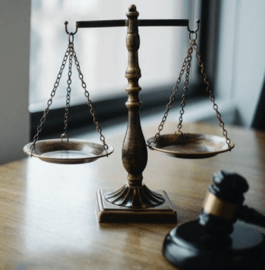 Judges desk with gavel and scales