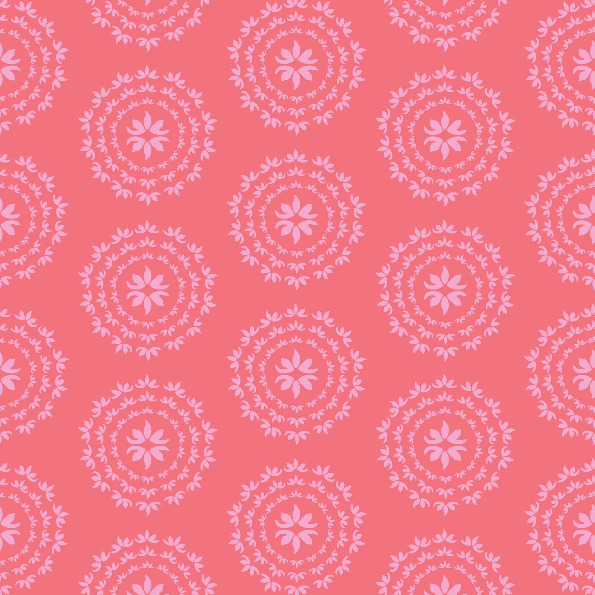 A seamless pattern with pale pink leaves in circles on a pink background.