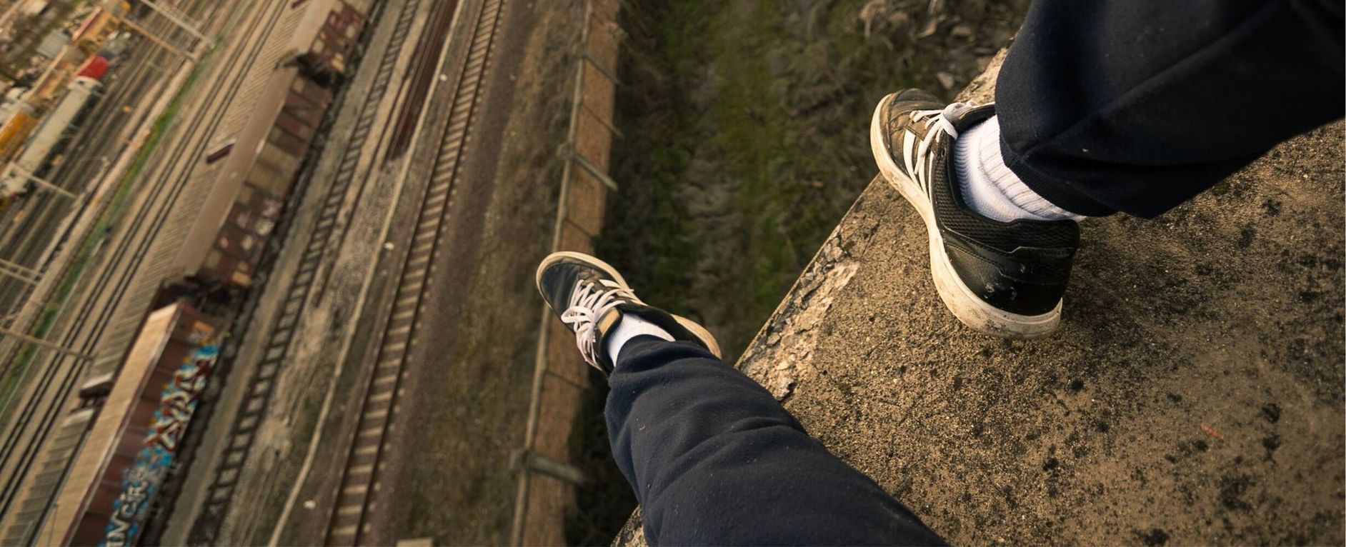 Man overlooks train tracks