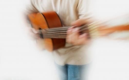 Man playing a guitar
