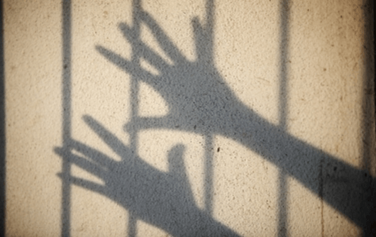 prisoner in cell silhouette
