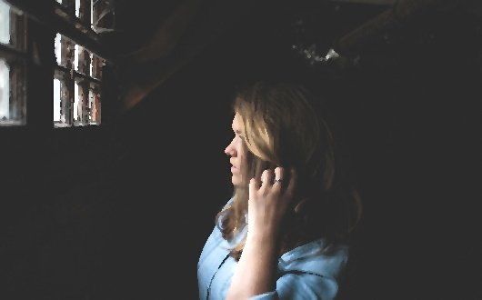 Woman in a jail cell